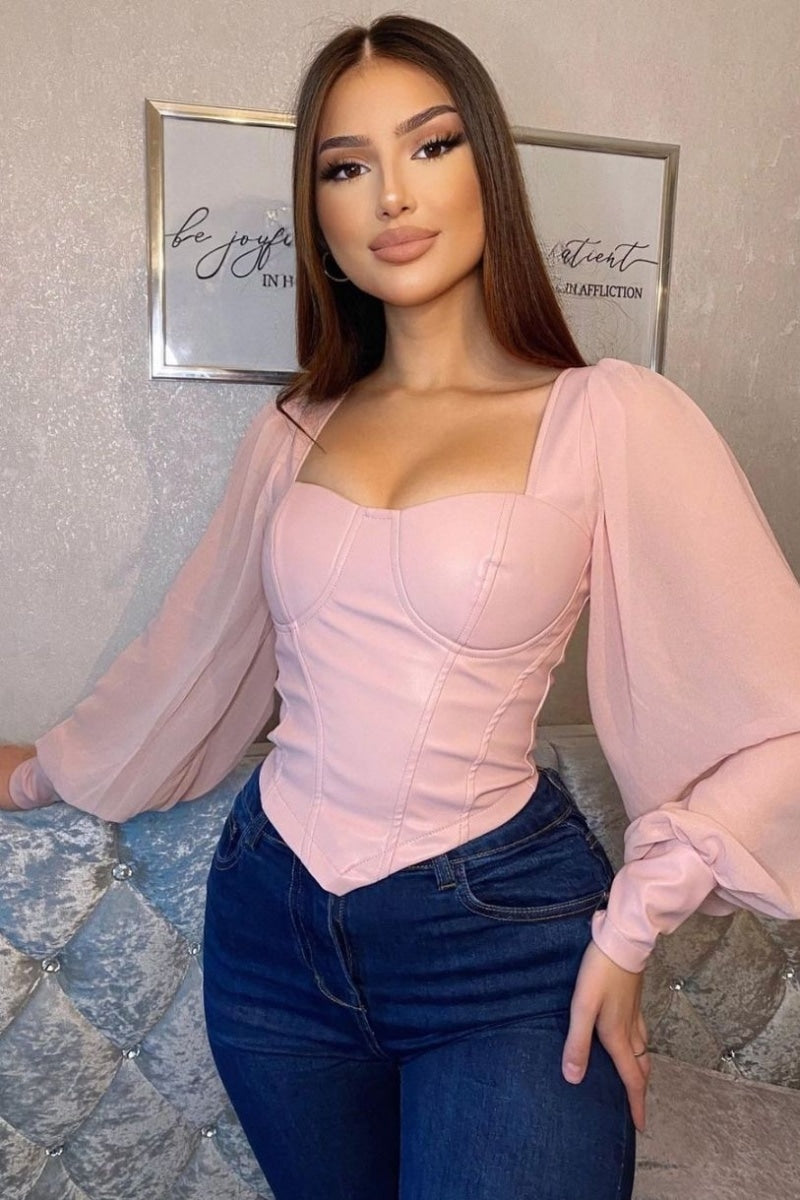 https://empresscouture.com/cdn/shop/products/pink-pu-corset-detail-top-with-sheer-sleeves-p8362-1102583_image.jpg?v=1617990354&width=1445